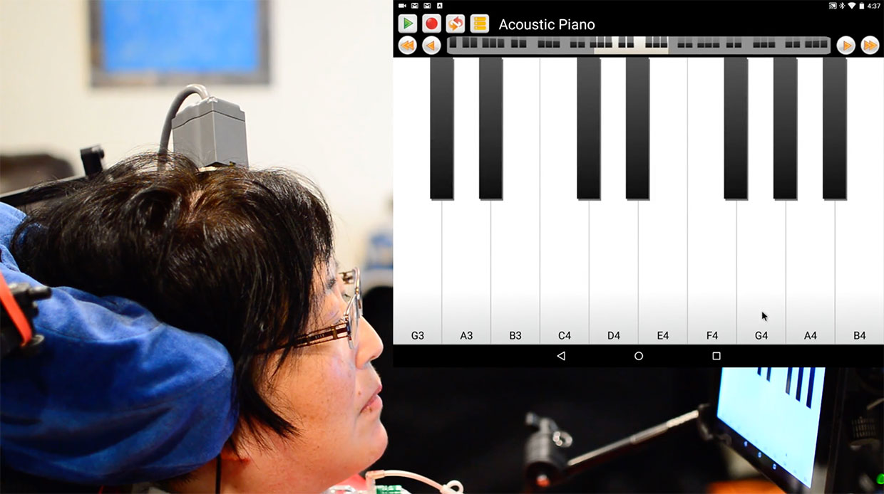 A participant in the BrainGate clinical trial directly controls a tablet computer through a brain-computer interface. The participant, a musician, played a snippet of 'Ode to Joy' on a digital piano interface.