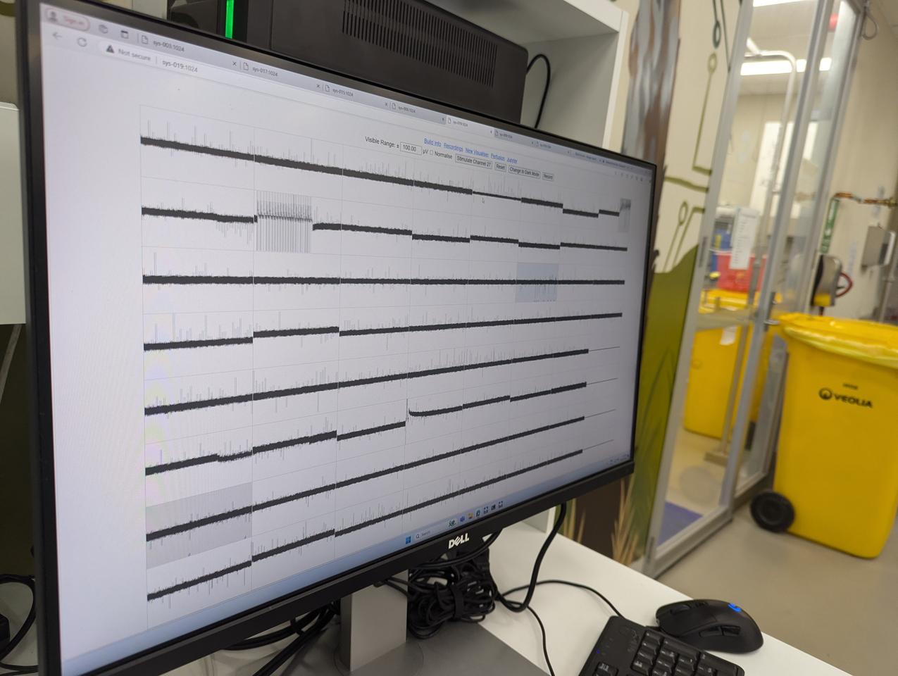 In the lab, the early CL1 model is put through its paces as the team monitors its response to stimuli (prompts)